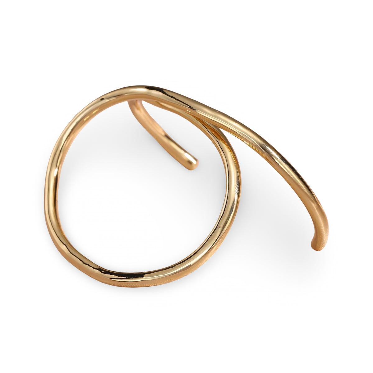 A polished gold open cuff bracelet with a smooth, flowing organic loop design