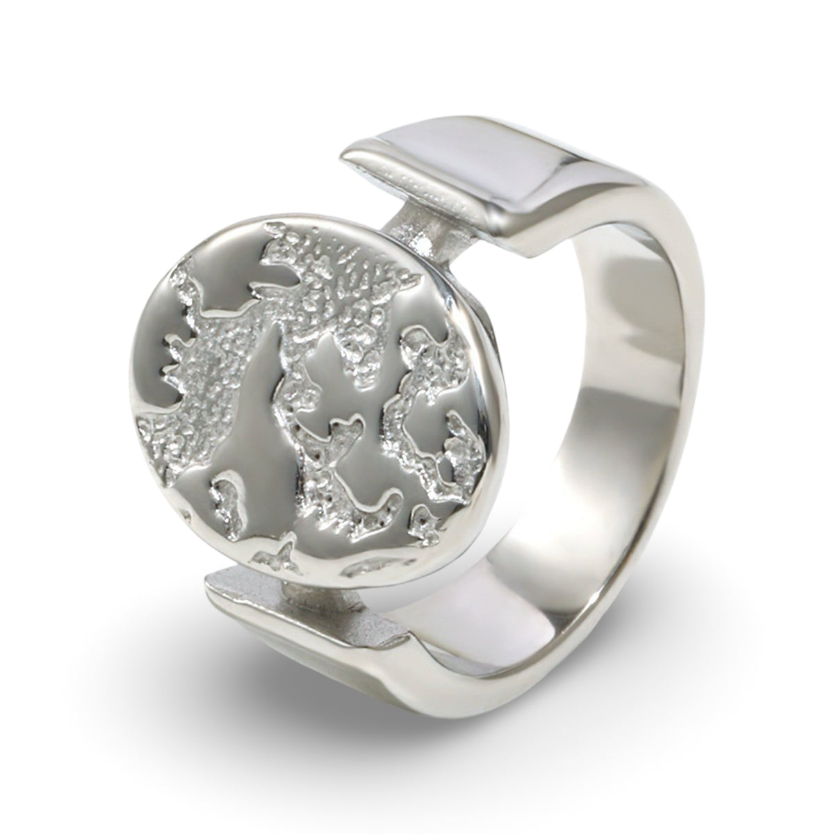 A textured oval ring featuring a raised relief design with an embossed tree motif.